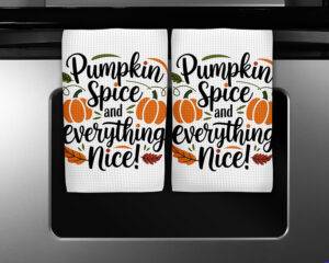 Fall kitchen towel with the phrase "Pumpkin Spice and Everything Nice" and pumpkin and leaf illustrations
