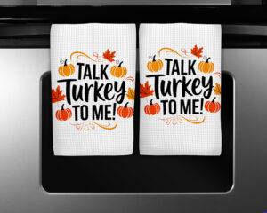Funny fall sublimation design reading "Talk Turkey to Me!" with pumpkins and autumn leaves, for kitchen towels