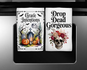 Halloween kitchen towel sublimation designs featuring Grave Intentions and Drop Dead Gorgeous watercolor illustrations with pumpkins, skull, candles, and gothic floral details.