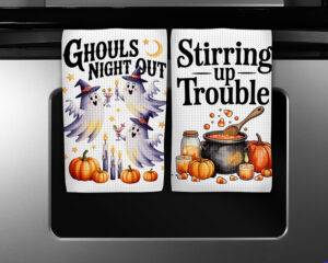 Halloween kitchen towel sublimation designs featuring Ghouls Night Out and Stirring Up Trouble watercolor illustrations with ghosts, cauldron, pumpkins, and candy corn.