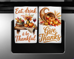 Thanksgiving kitchen towel sublimation designs featuring Eat Drink & Be Thankful and Give Thanks watercolor illustrations with pumpkins, apples, and cornucopia.