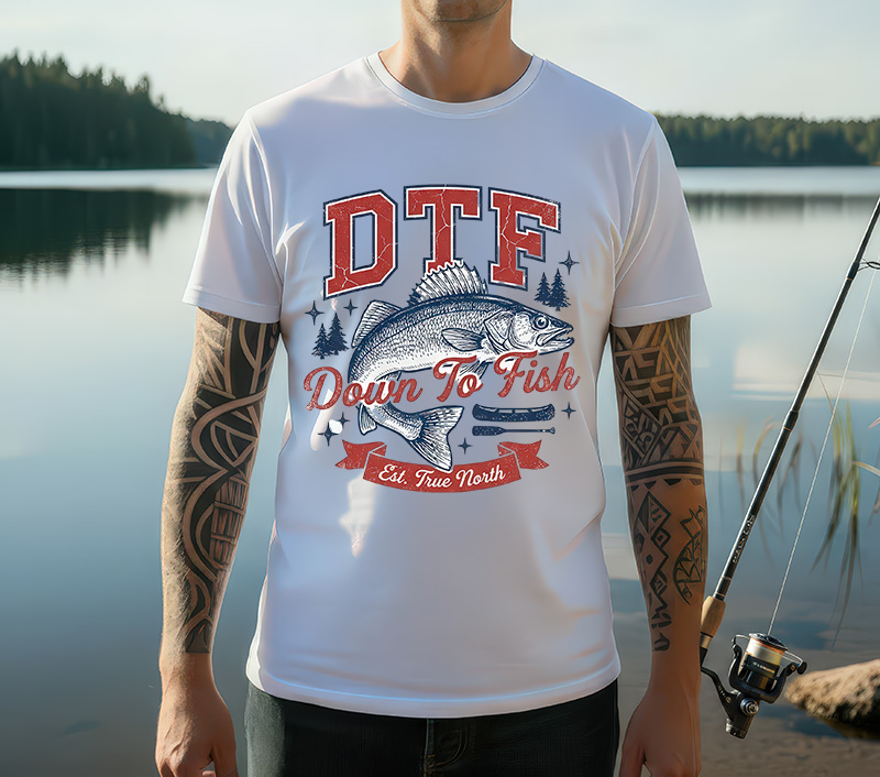 DTF Down To Fish sublimation PNG design featuring vintage bass fish illustration with red collegiate typography pine trees and canoe accents on white t-shirt mockup