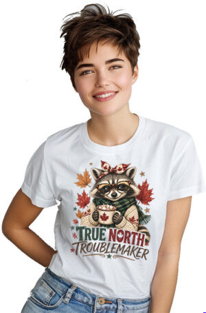 True North Troublemaker PNG featuring a funny Canadian raccoon wearing sunglasses, a bow, and green scarf while holding a maple leaf mug with fall leaves and playful lettering.